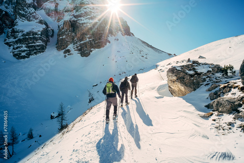 Dolomiti - hikers with snowshoes