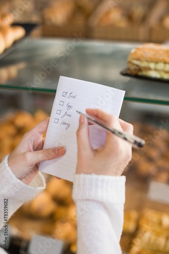 Woman checking her shopping list