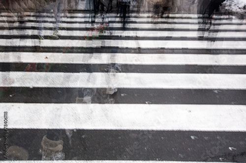 People crossing a road, blurred, in motion