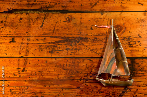 Copper Sailboat on Textured Wood