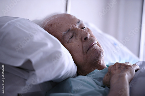 Old man sleeping in a hospital