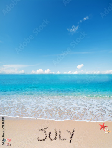 july on a tropical beach under clouds