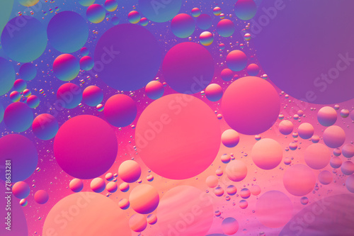 Psychedelic oil and water abstract in purple, red and blue