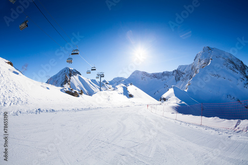 Ski piste panorama with ropeway chair lift