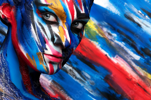 girl in a bright colored paint body art