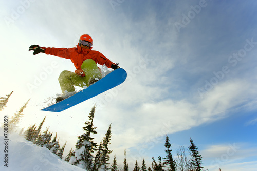 Snowboarder jumping