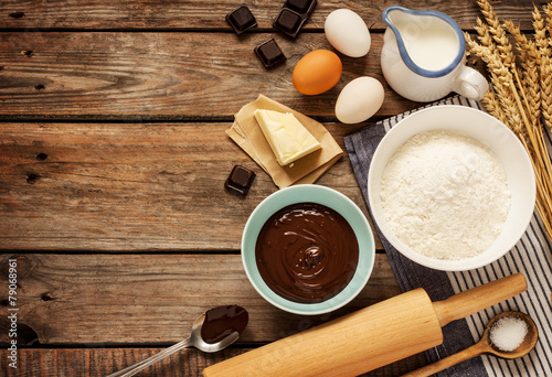 Baking chocolate cake - recipe ingredients on vintage wood