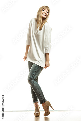 blonde fashion woman in white shirt denim pants