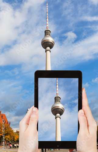 tourist taking photo of TV tower on alexanderplatz