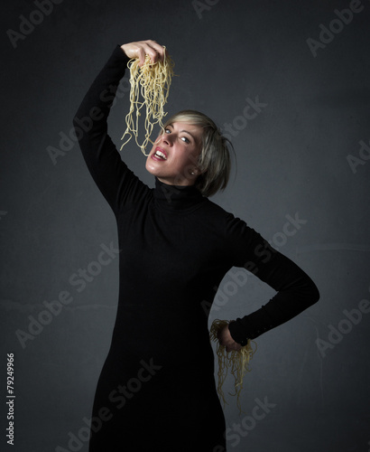 girl biting spaghetti