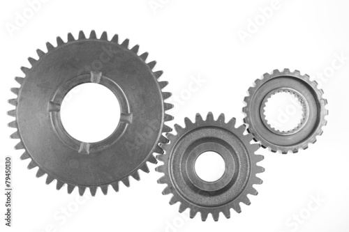 Three steel cog gear isolated on white.