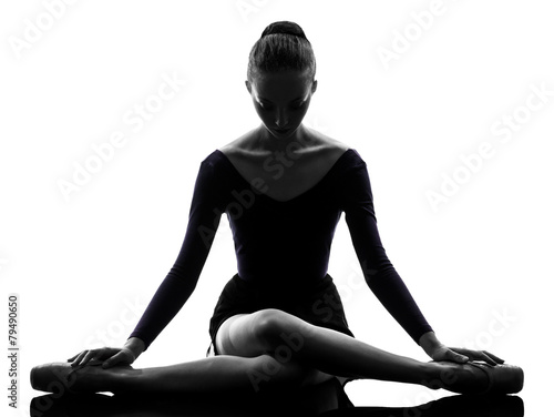 young woman ballerina ballet dancer stretching warming up silho