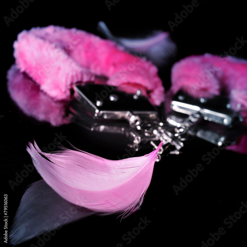 sexy fluffy handcuffs and feathers used as adult toys