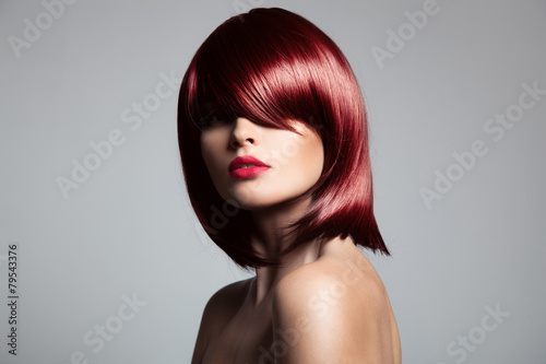 Beautiful red hair model with perfect glossy hair. Close-up port