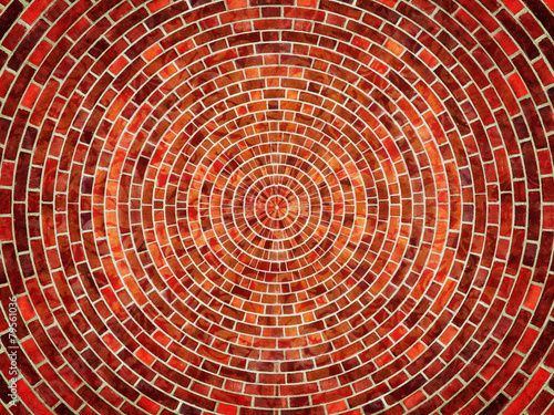 Radial red brick wall texture pattern.