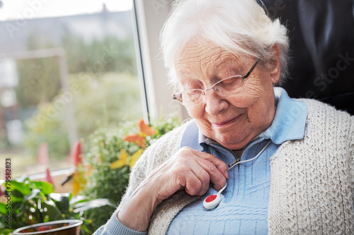 Elderly person with emergency button