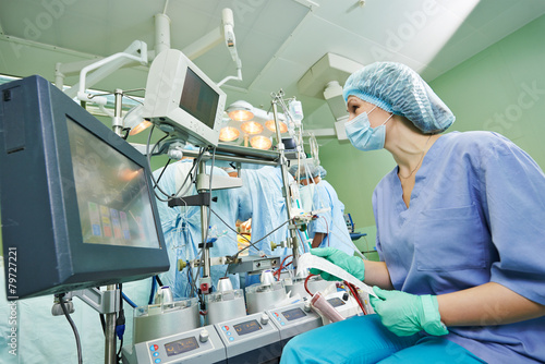 surgery nurse working during operation