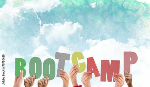 Composite image of hands holding up boot camp