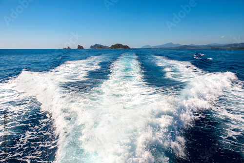 Waves on blue sea behind the boat