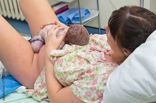 Young woman giving birth