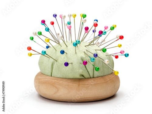 Pin cushion full with colorful pins