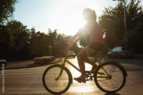 Young Female Riding Bike