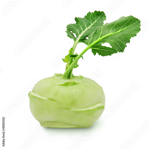 Fresh kohlrabi with green leaves on isolated white backround