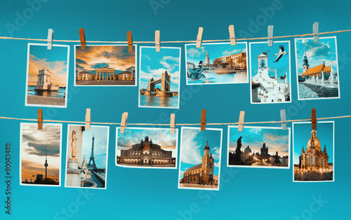 Pictures of european landmarks pinned on ropes, toned image