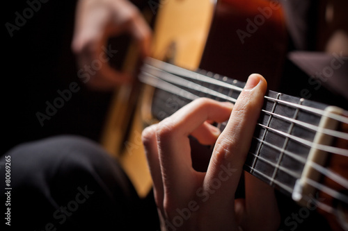 Man playing acoustic guitar