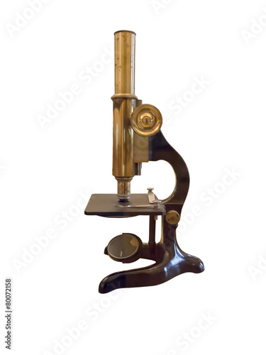 Old vintage microscope isolated over white