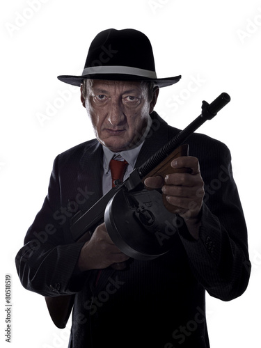 Old style gangster with tommy gun, on white background