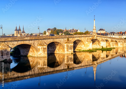 Medieval bridge over Loire River in old town of Blois, France