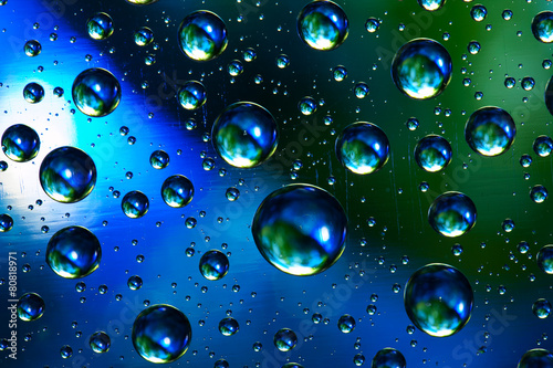 Abstract background texture drops of water and art light on glas