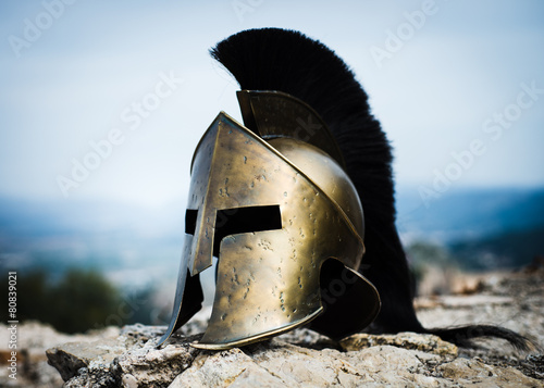 Spartan helmet on rocks.