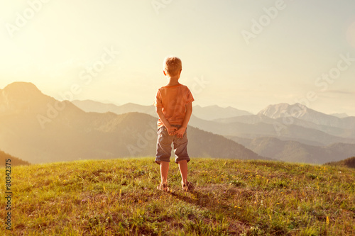 Toddler enjoys view over the mountains