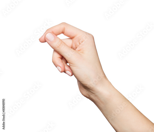 Woman's hand holding something, isolated on white