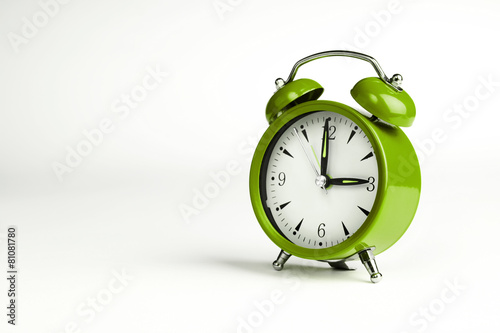 Three o'clock. Green classic clock on white background.