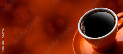 Cup of black coffee on bokeh background. Banner of a cup of 