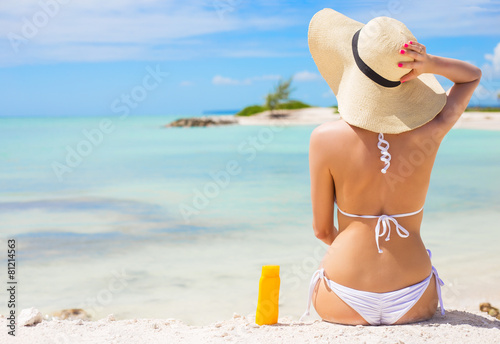 Woman sunbathing on the beach