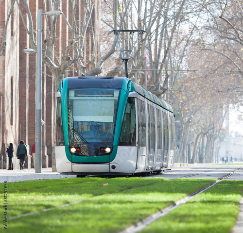 Ordinary tram on street of city