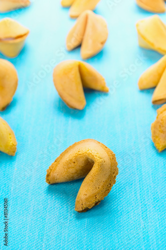 fortune cookies on blue background, close up