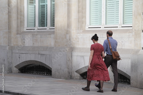 Young couple walking in a street of London