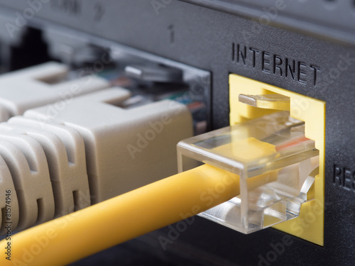 Network cables connected to a router or modem