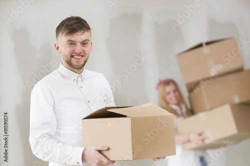 Happy young couple moving in their new home
