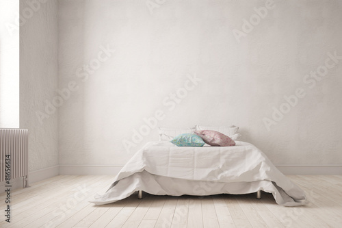 Schlichtes Schlafzimmer mit Bett an Wand