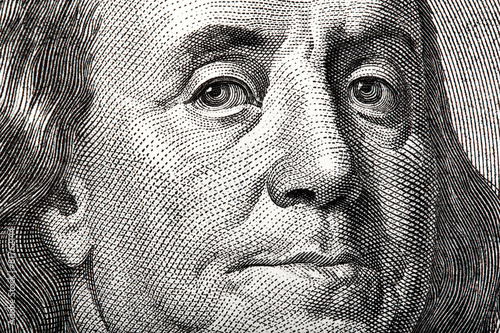 Portrait of Ben Franklin on the US $100 dollar bill in macro.