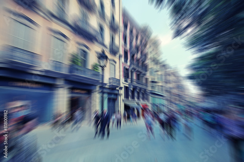 Abstract background. Pedestrians walking in Barcelona, Spain.