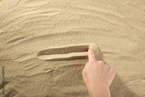 Draw your finger on the sand