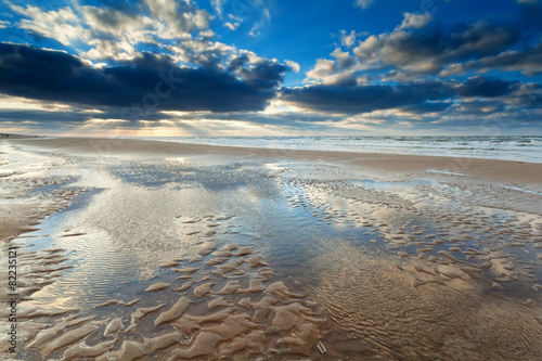 sunshine over North sea beach at low tide