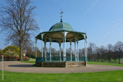 Octagobnal Victorian bandstand in English park.